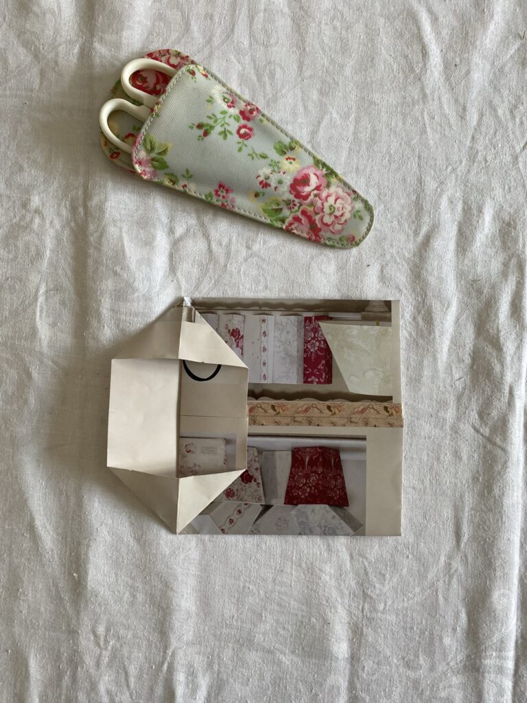 folding paper to make a recycled paper gift bag