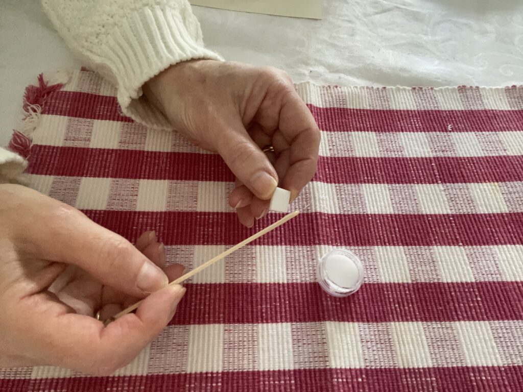 ladies hands gluing glass 