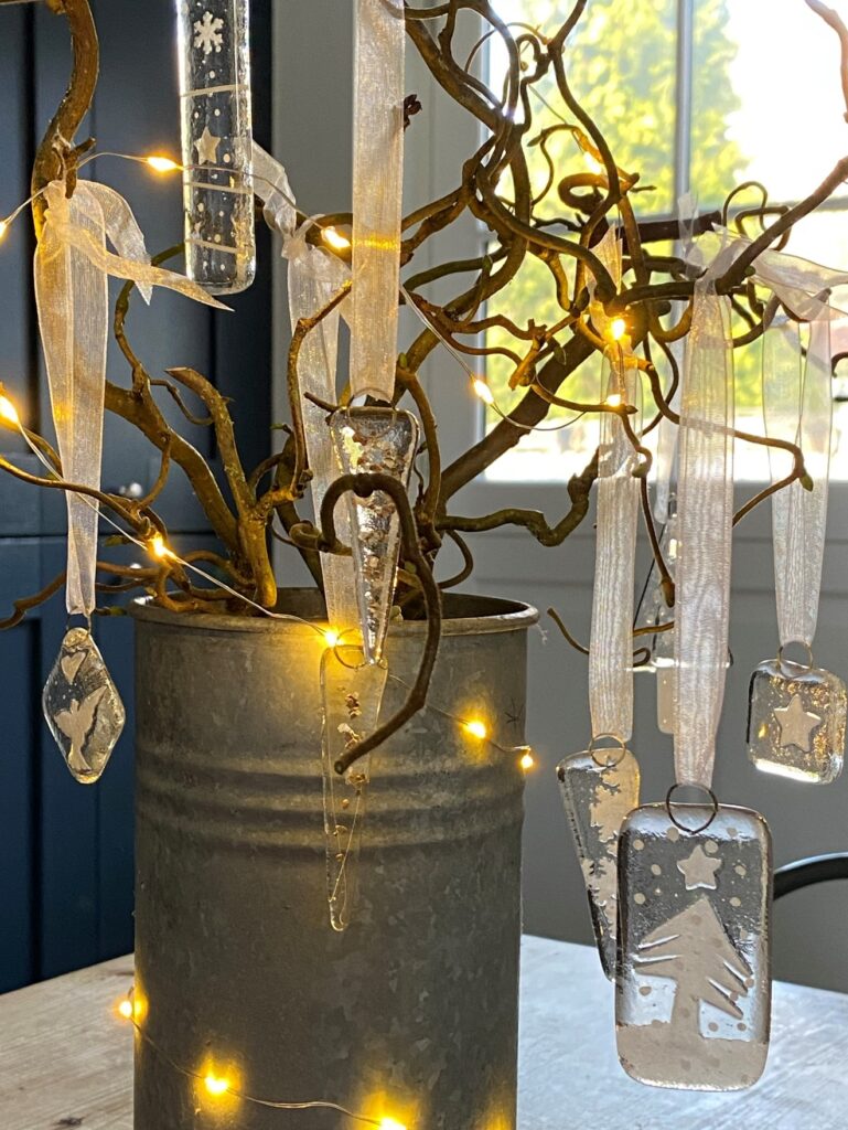 galvanised vase with twig tree fairy lights and handmade glass christmas decorations