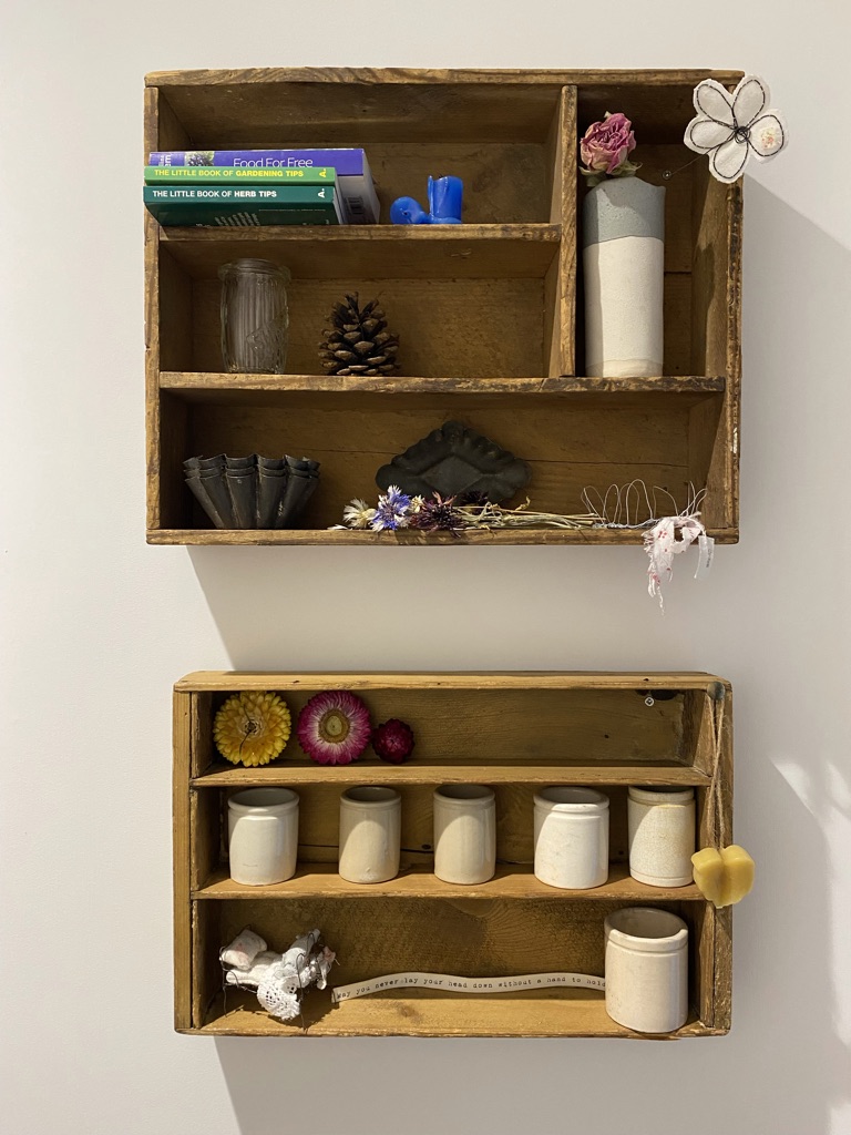 wooden wall shelves with curiosities