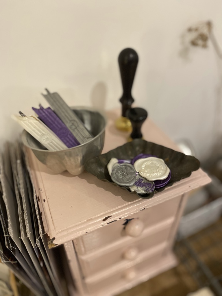 wax seal, seals and sticks on pink box