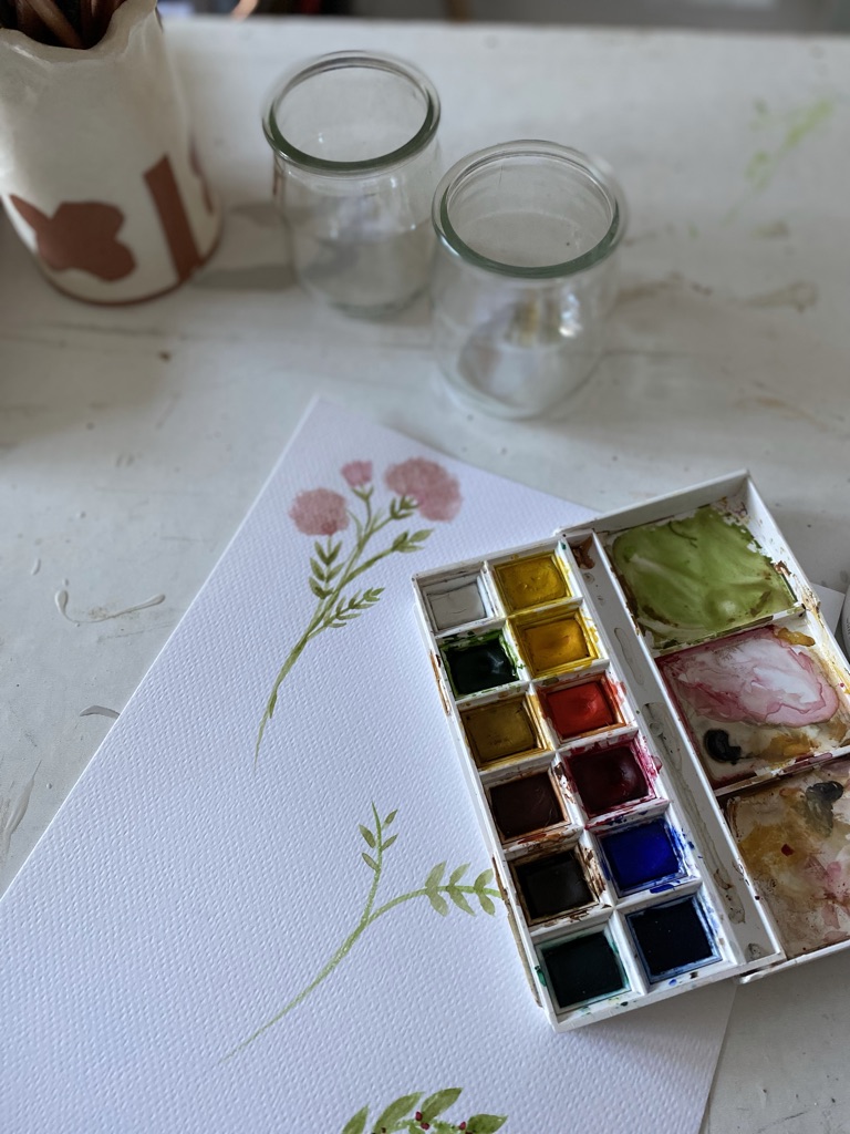 beginners watercolour painting and pallet of paints