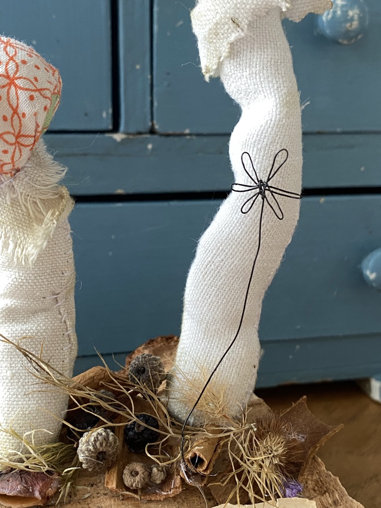 wire flower with fabric mushrooms and berries and dried flowers