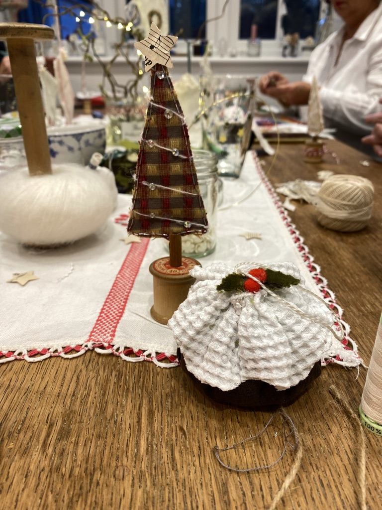 fabric Christmas pudding, Christmas trees, fabrics, vintage cotton reel and other crafty ephemera