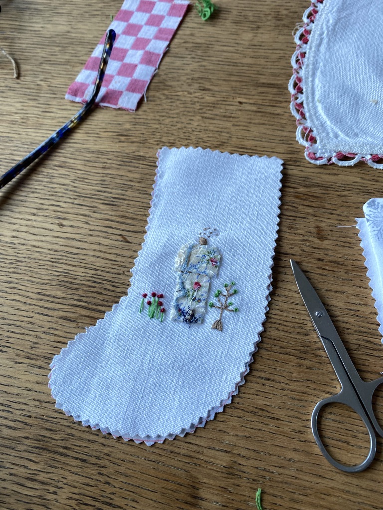 mini Christmas stocking, scissors and fabrics