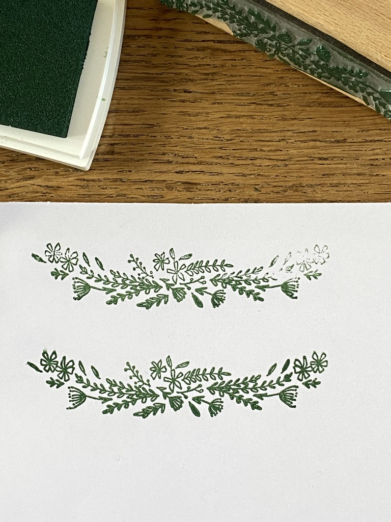 green floral designs made from rubber stamp shown with green ink pad