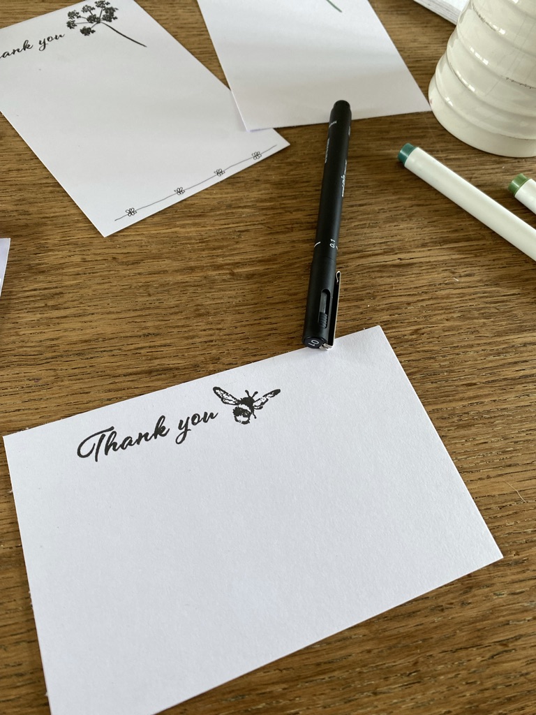 pens and a selection of homemade thank you cards using rubber craft stamps