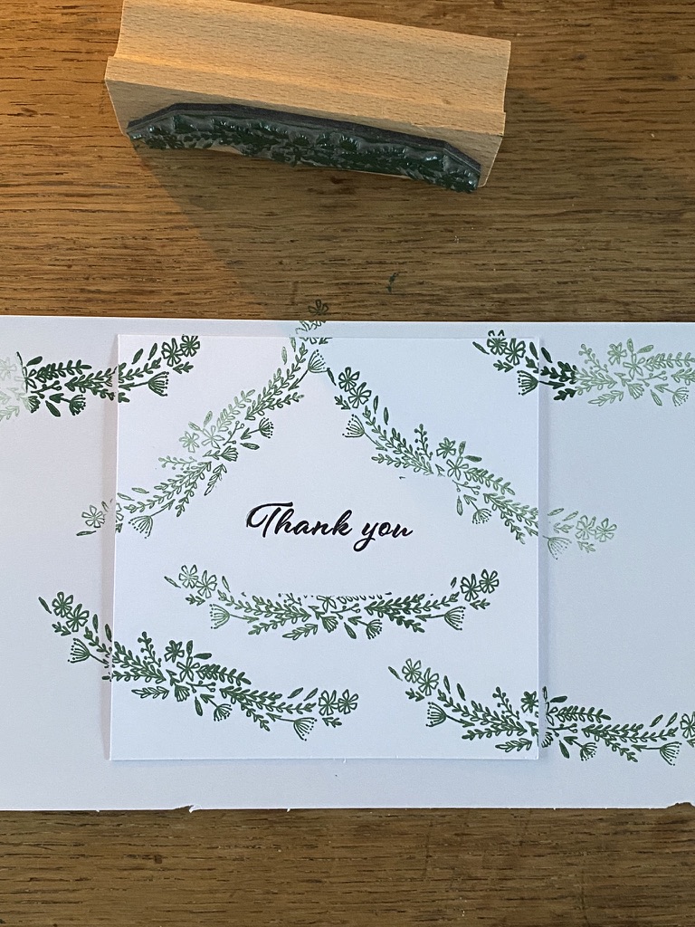 green floral stamped paper with thank you design and craft stamp