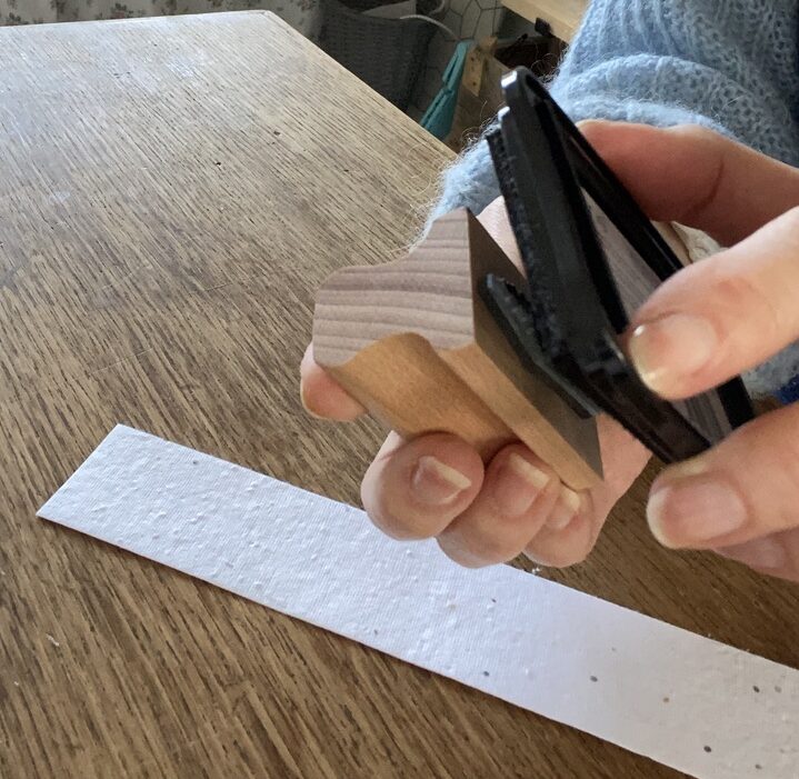 lady's hands demonstrating how to ink a craft stamp