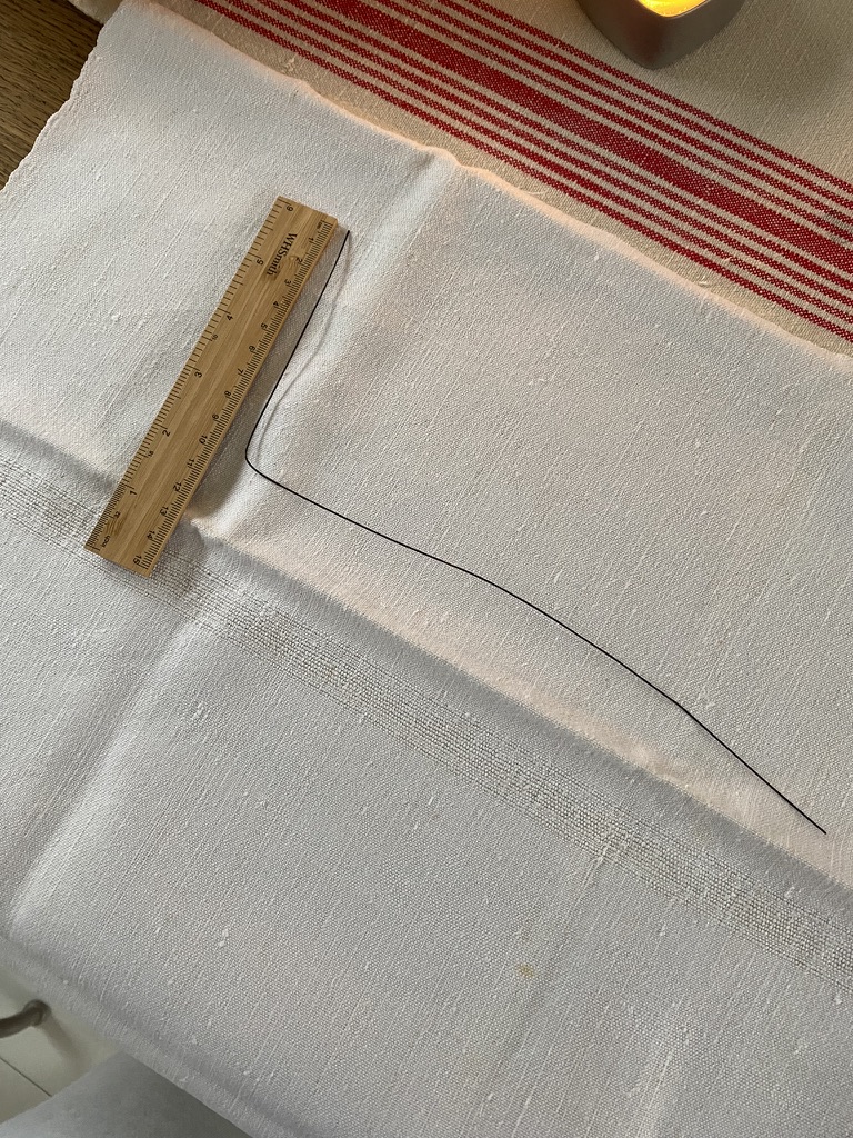 white linen, wooden ruler and bent wire