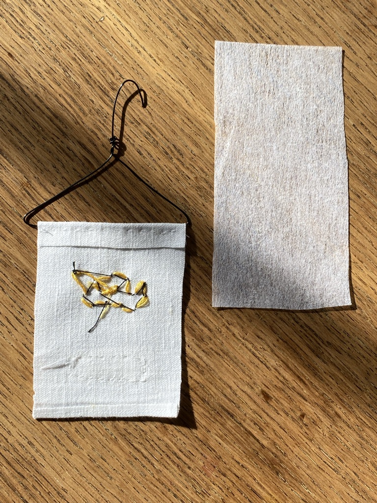 reverse of bumble bee embroidery is covered with fusible backing